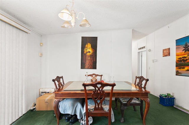 dining space featuring a textured ceiling, carpet flooring, and a chandelier