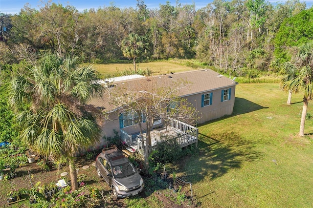 birds eye view of property with a wooded view