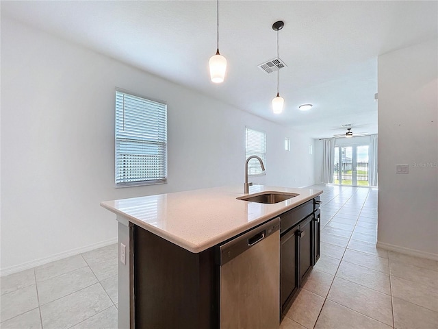 kitchen with decorative light fixtures, visible vents, stainless steel dishwasher, open floor plan, and a sink