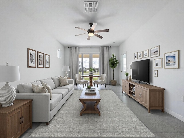 living area with ceiling fan, visible vents, baseboards, and light tile patterned flooring