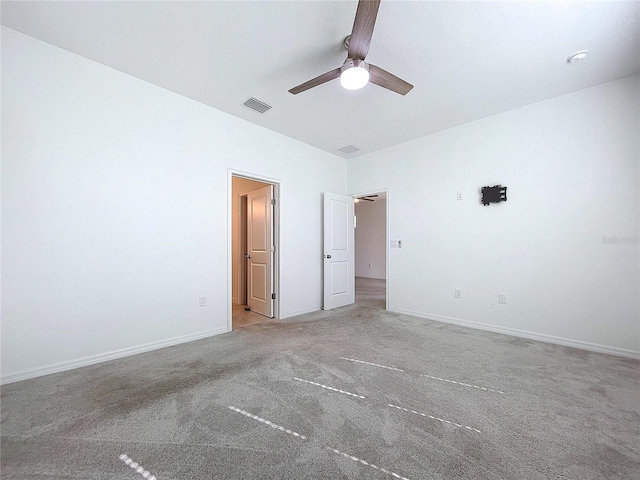 unfurnished bedroom with a ceiling fan, baseboards, visible vents, and carpet flooring