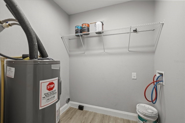 utility room with water heater