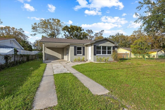 bungalow-style house featuring an attached carport, fence, stucco siding, concrete driveway, and a front lawn