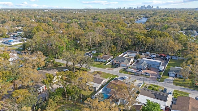 bird's eye view featuring a forest view and a residential view