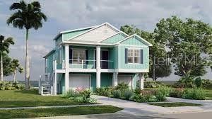 raised beach house with driveway, an attached garage, and a balcony