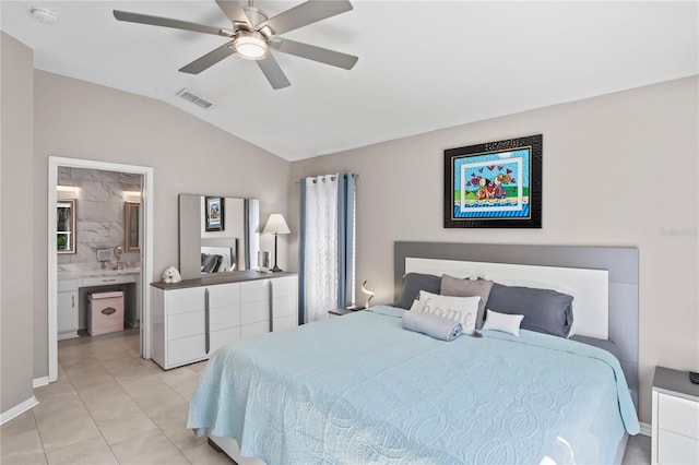 bedroom featuring light tile patterned floors, ensuite bathroom, a ceiling fan, visible vents, and vaulted ceiling