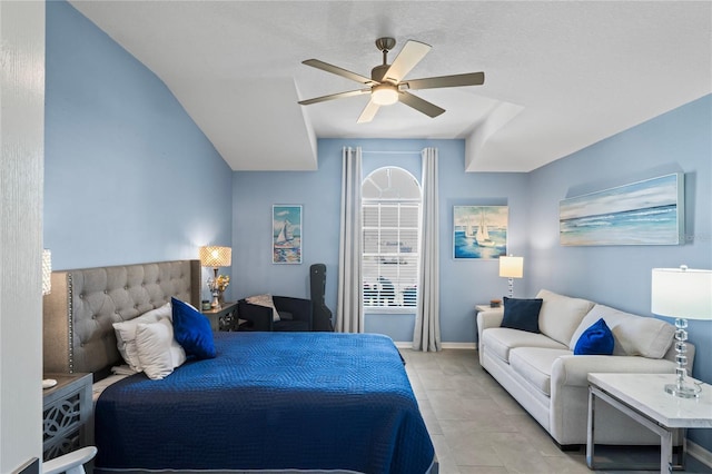 bedroom with ceiling fan, baseboards, and light tile patterned floors