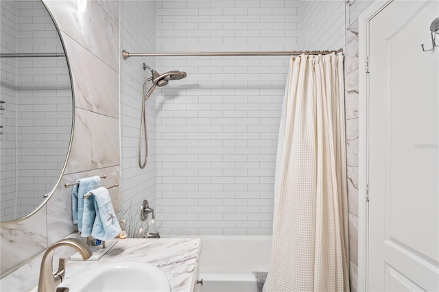 bathroom featuring shower / bath combo and vanity