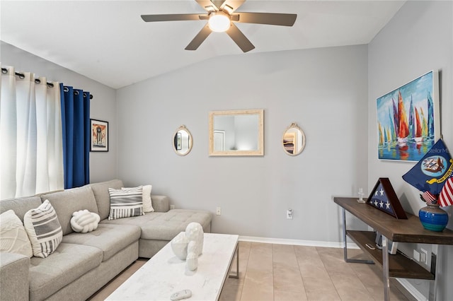 living area with vaulted ceiling, a ceiling fan, and baseboards