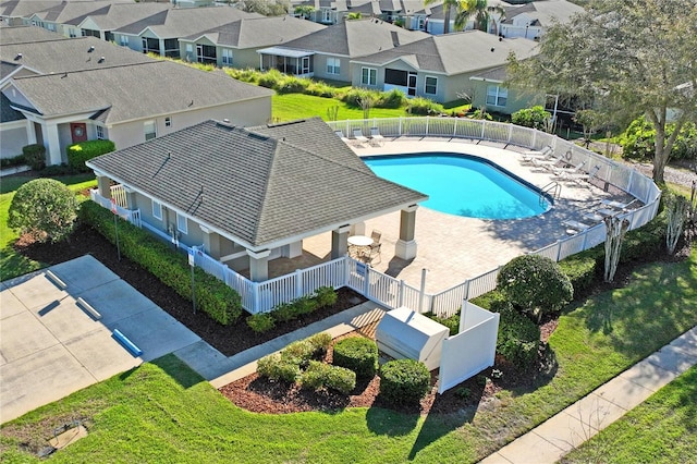 birds eye view of property with a residential view