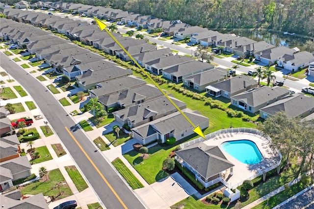 bird's eye view with a water view and a residential view