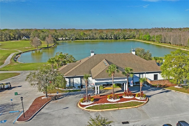 aerial view featuring a water view and a view of trees