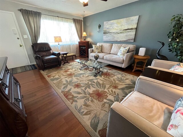 living area with ceiling fan and wood finished floors