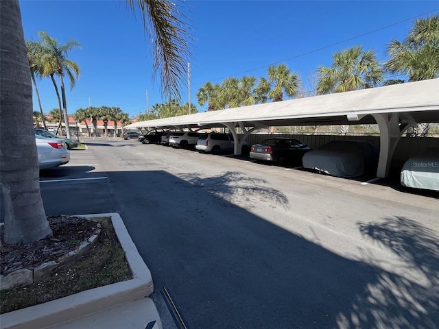 view of partially covered parking lot