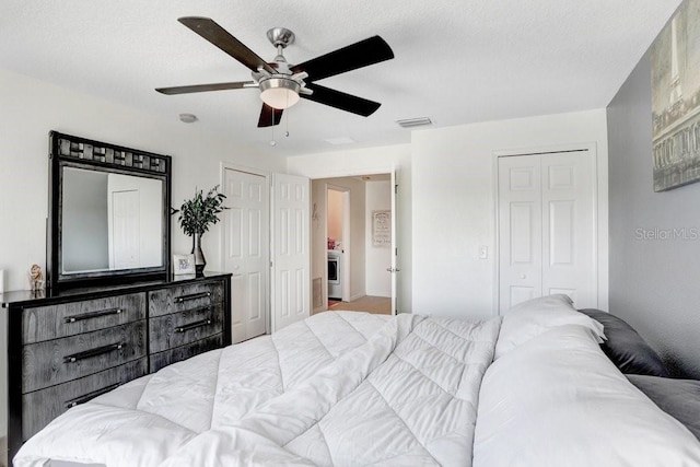 bedroom featuring a closet, visible vents, and ceiling fan