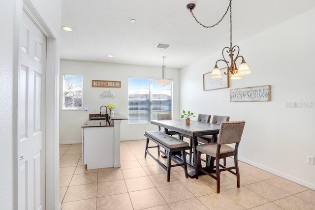 dining room with light tile patterned floors, a textured ceiling, recessed lighting, visible vents, and baseboards