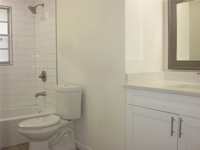 bathroom featuring shower / tub combination, vanity, and toilet