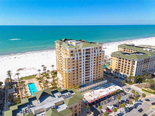 bird's eye view featuring a view of the beach and a water view