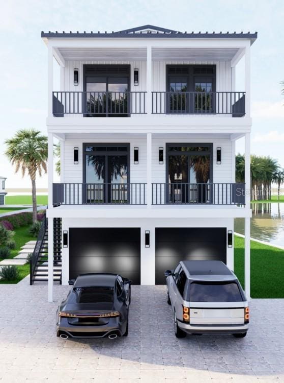 exterior space with board and batten siding, concrete driveway, and stairway