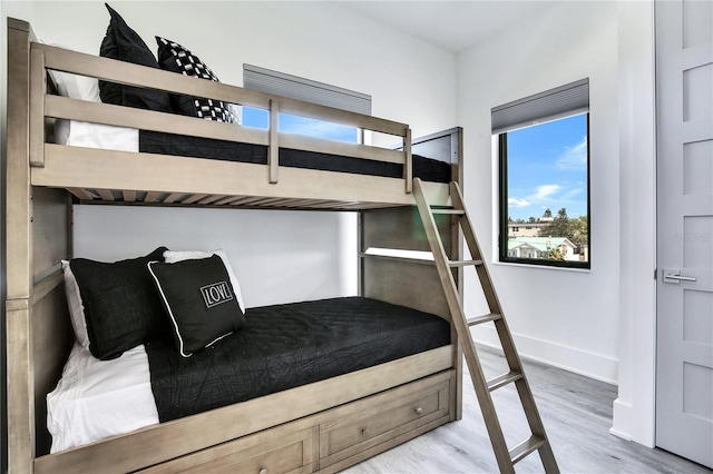 unfurnished bedroom featuring baseboards and wood finished floors