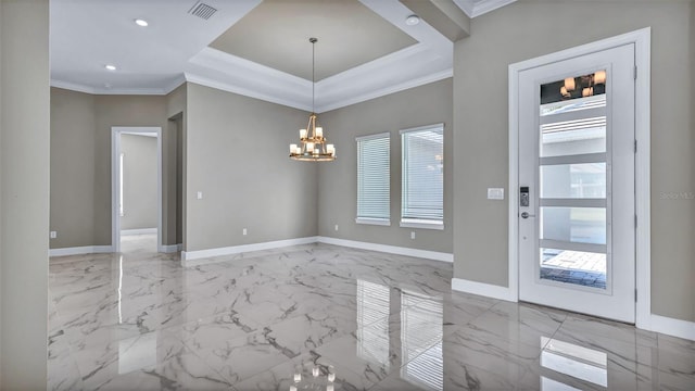 interior space with a tray ceiling, visible vents, an inviting chandelier, ornamental molding, and baseboards