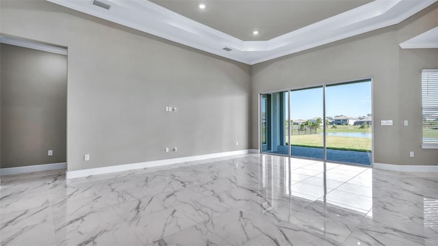 unfurnished room with recessed lighting, a raised ceiling, visible vents, ornamental molding, and baseboards