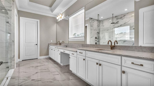 bathroom featuring vanity, marble finish floor, ornamental molding, a marble finish shower, and a tray ceiling