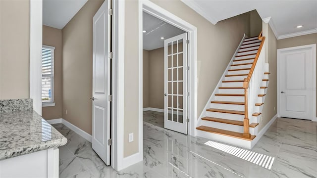 stairway featuring recessed lighting, marble finish floor, crown molding, and baseboards