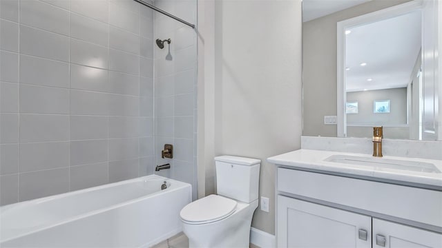 bathroom featuring shower / bath combination, vanity, and toilet