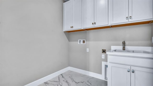 clothes washing area featuring marble finish floor, hookup for a washing machine, a sink, electric dryer hookup, and baseboards