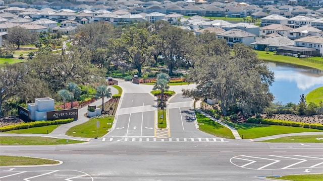 bird's eye view featuring a water view and a residential view