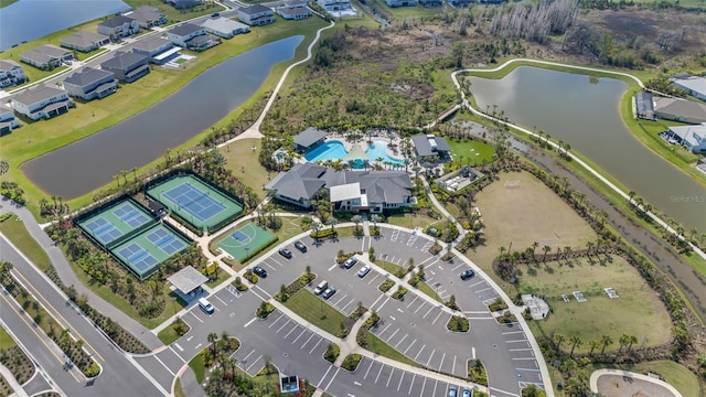 birds eye view of property with a water view and a residential view