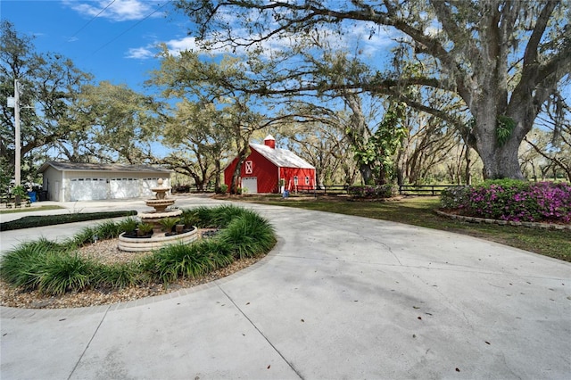 exterior space featuring driveway and a barn