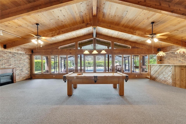 recreation room featuring carpet floors, a brick fireplace, ceiling fan, and wood ceiling