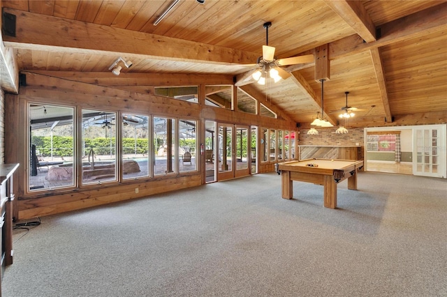 rec room featuring lofted ceiling with beams, a healthy amount of sunlight, wood ceiling, and carpet flooring