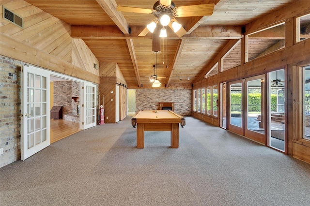 playroom featuring wooden ceiling, beam ceiling, and french doors