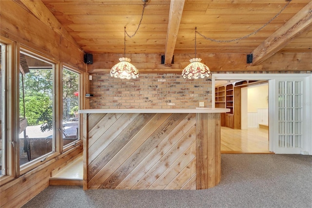 bar featuring wooden walls, wood ceiling, beamed ceiling, carpet floors, and pendant lighting