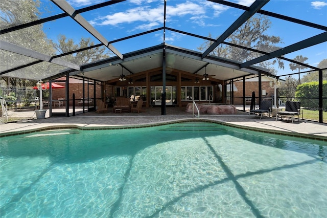 view of pool with a ceiling fan, a fenced in pool, and a patio area