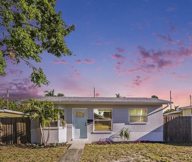 679 71st Ave N, Saint Petersburg, FL 33702 - view of front of home featuring concrete block siding and fence