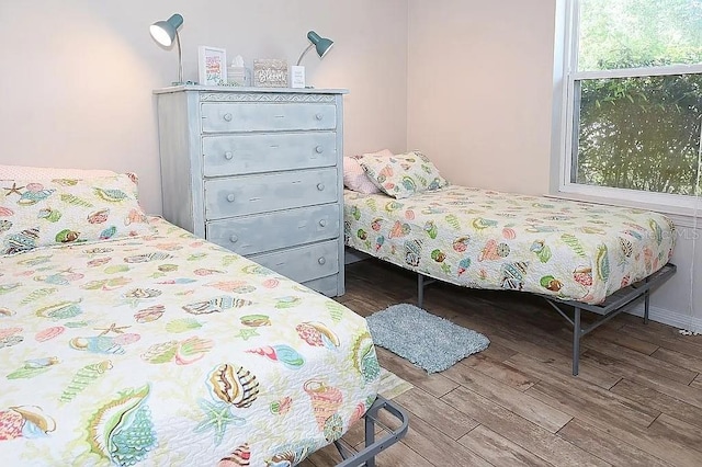 bedroom with wood finished floors