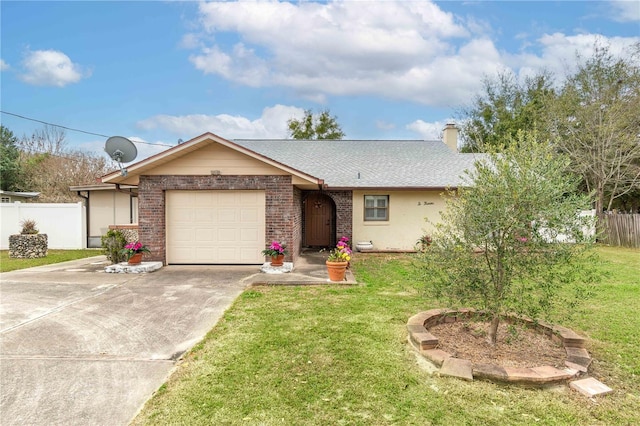 single story home with a garage, fence, a front lawn, and concrete driveway