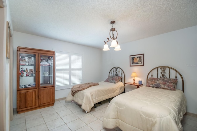 12172 SE 96th Ter, Belleview, FL 34420 - bedroom with a textured ceiling and light tile patterned floors