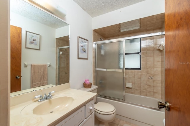 12172 SE 96th Ter, Belleview, FL 34420 - full bathroom with toilet, bath / shower combo with glass door, a textured ceiling, and vanity