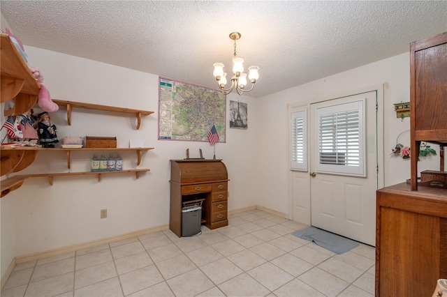 12172 SE 96th Ter, Belleview, FL 34420 - entrance foyer featuring light tile patterned floors, a textured ceiling, baseboards, and an inviting chandelier