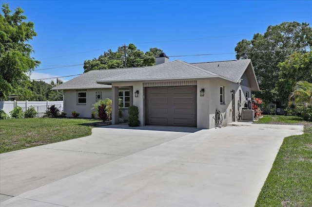 ranch-style house with stucco siding, a front yard, fence, a garage, and driveway