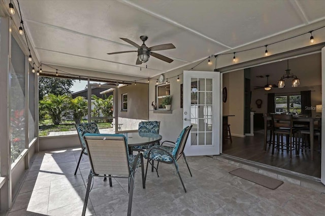 sunroom with french doors and ceiling fan