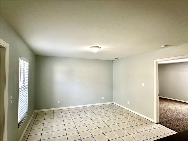 empty room featuring baseboards