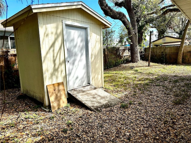 view of shed featuring a fenced backyard