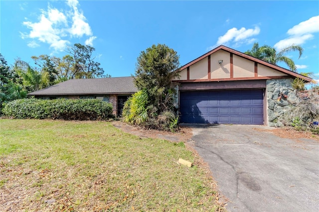 view of front facade with a garage and a front lawn