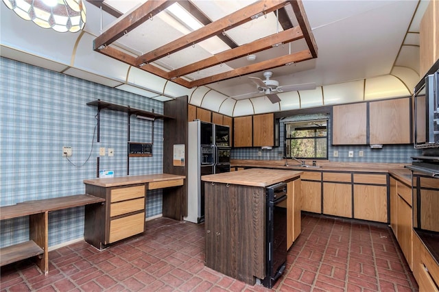 kitchen featuring wallpapered walls, tasteful backsplash, ceiling fan, wood counters, and brick floor